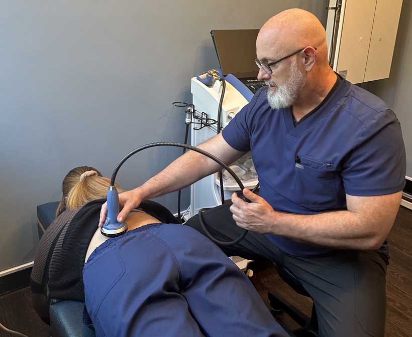 patient receiving spinal decompression in Raleigh for back pain relief