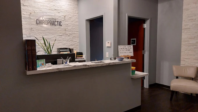 Corrective Chiropractic In Raleigh receptionist helping patinet with billing