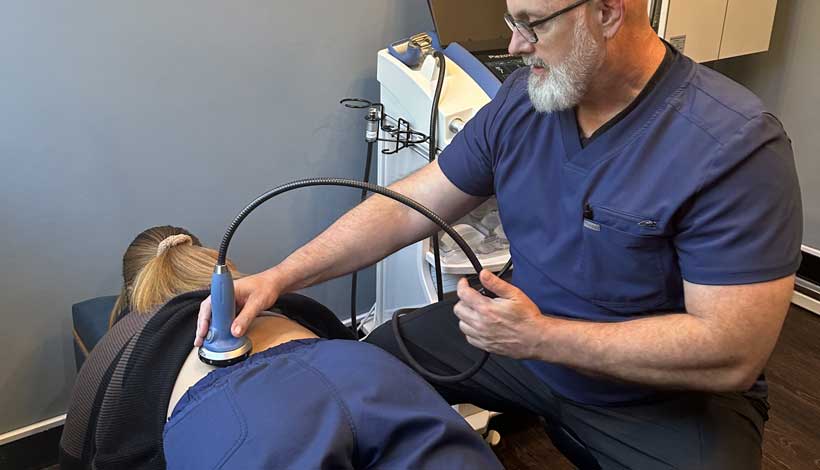 patient receiving spinal decompression in Raleigh for Back Pain relief