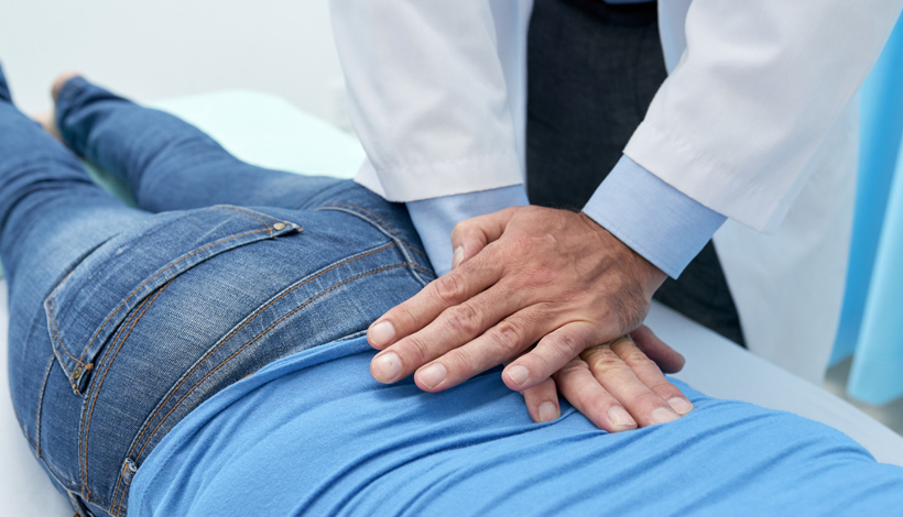 patient receiving spinal decompression in Raleigh for Facet Joint Syndrome relief