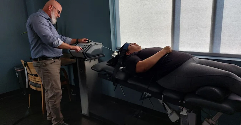 patient receiving spinal decompression in Raleigh for back pain relief